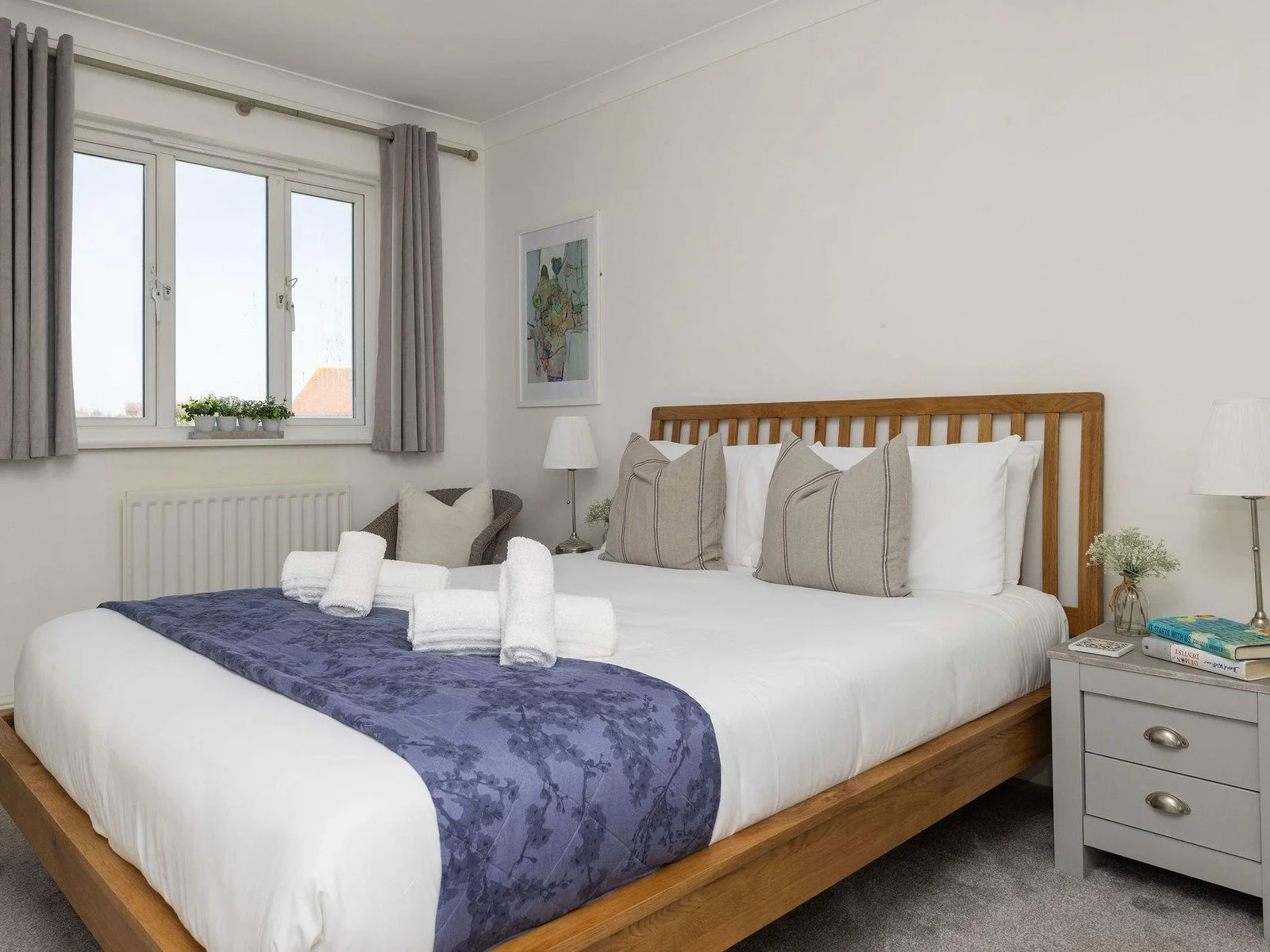 Spacious and inviting king bedroom with soft linens for a restful coastal getaway.