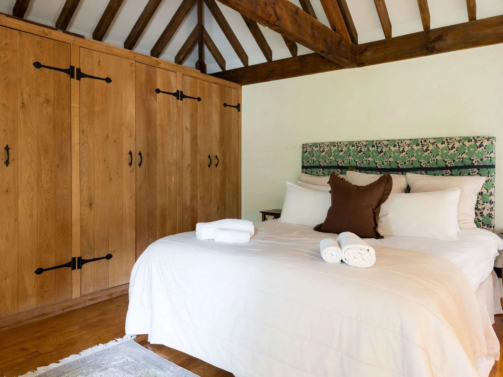 Spacious super king bedroom with a stylish en-suite and statement roll-top bath