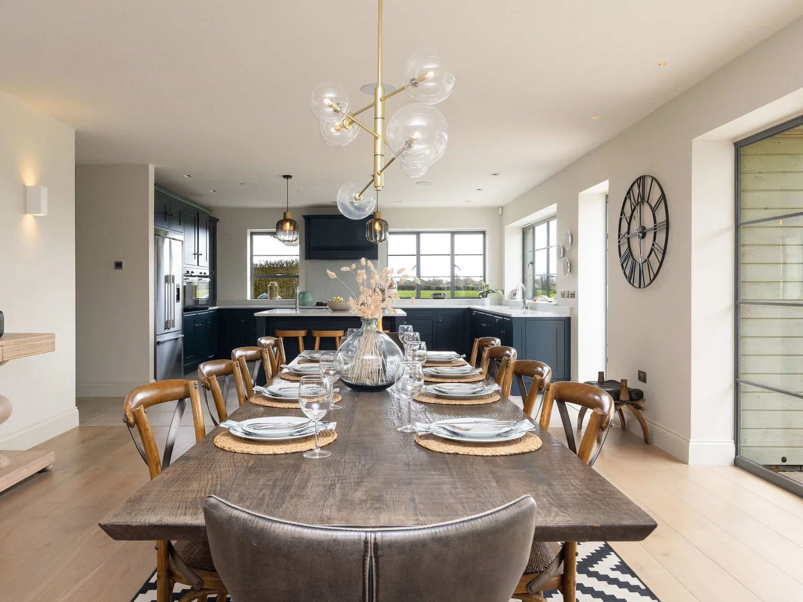 Elegantly set dining table ready for special occasions, comfortably seating the whole group.