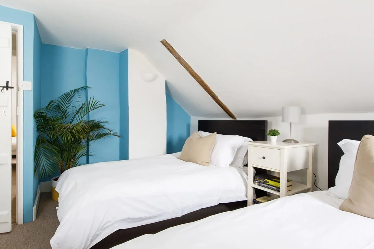The top floor has two twin rooms.