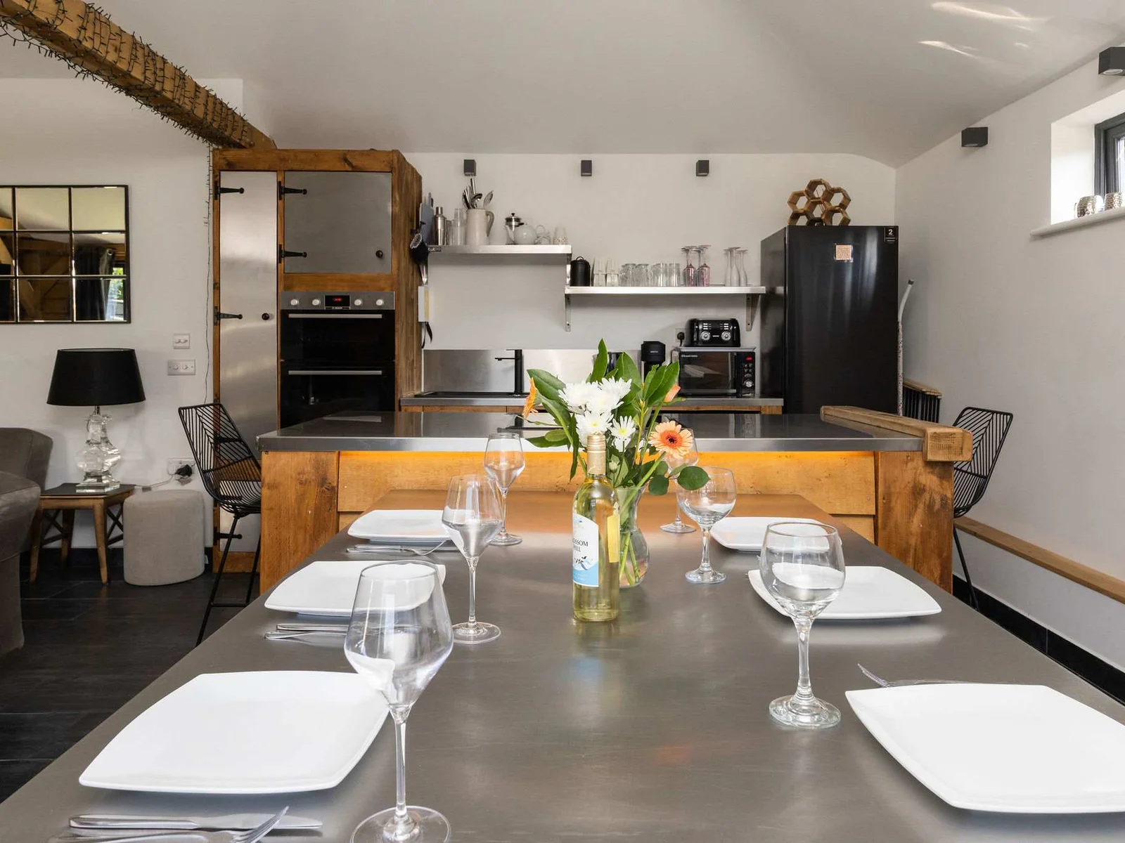 Gather around the substantial dining table, perfectly designed for memorable family meals and entertaining.