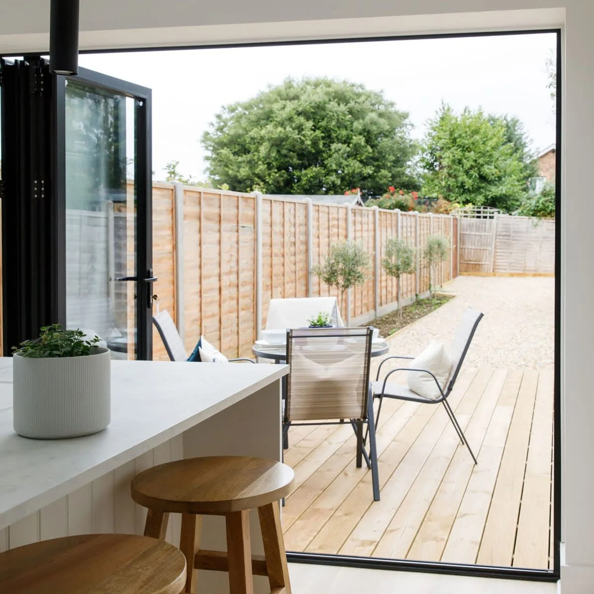 Open up the bi-fold door and head out from the kitchen to a perfectly manicured outside space.