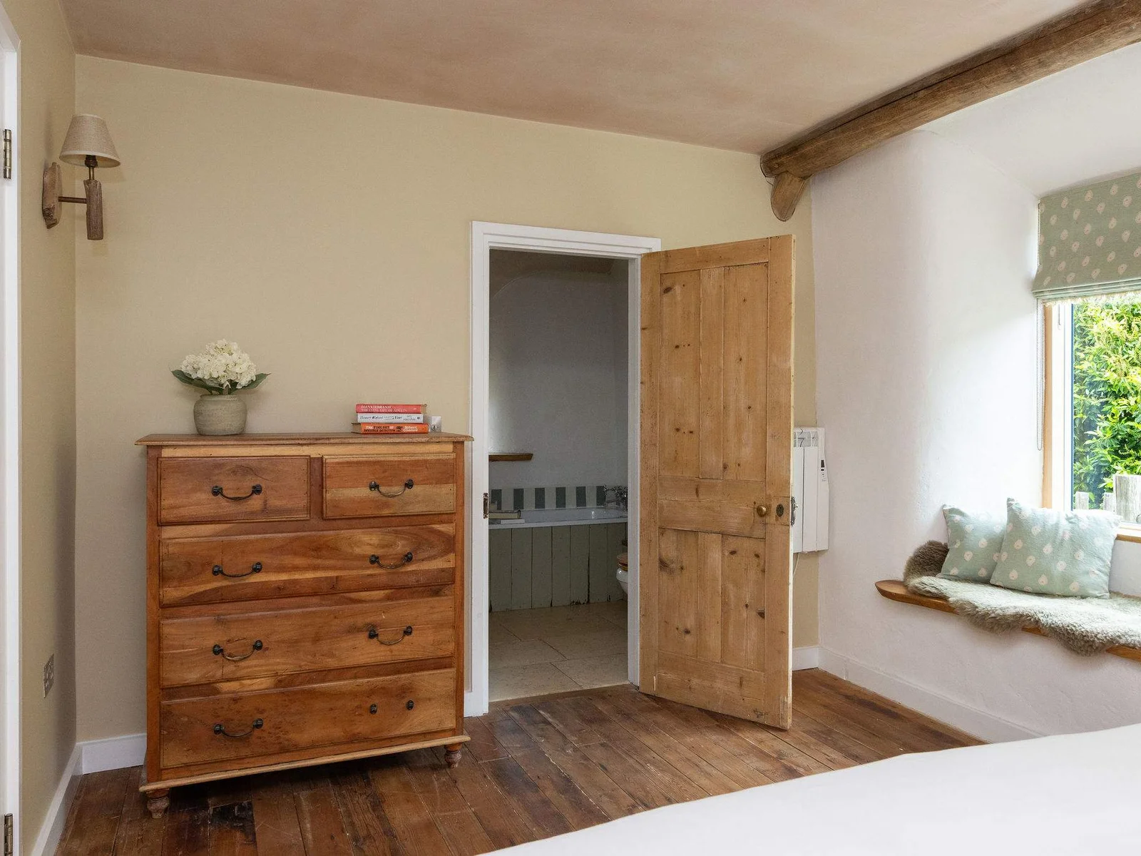 Characterful bedrooms with rustic timber details, cosy window seats and countryside charm.