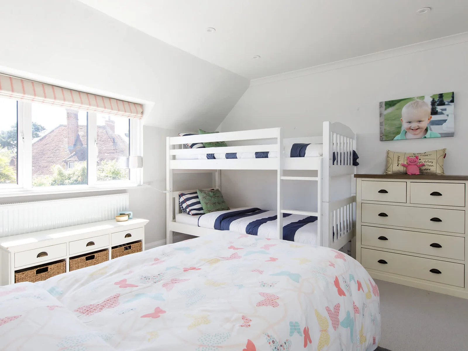 The room can sleep up to 4, with a trundle bed as well as bunks.