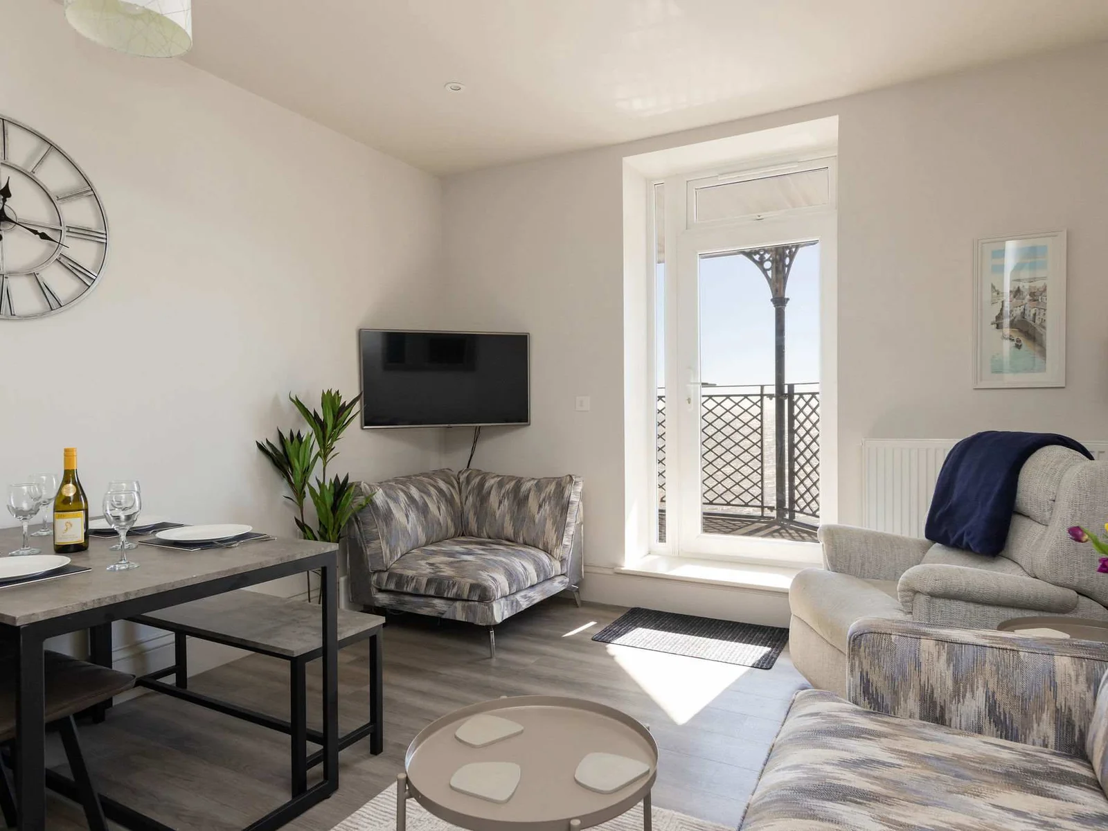 Light-filled living spaces and balcony access make this a relaxed and scenic seafront stay.