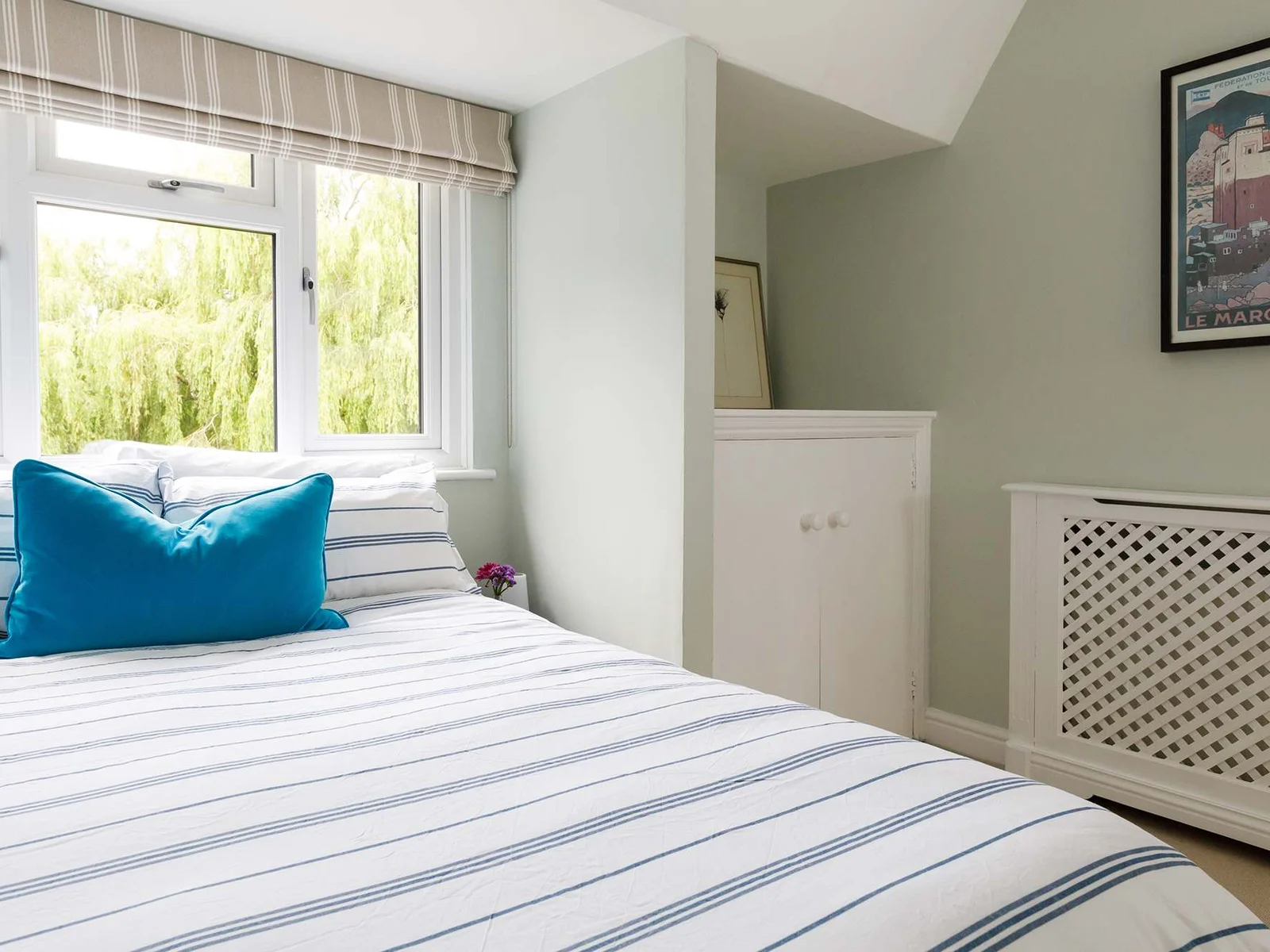 Soft greens and creams create a relaxing double..