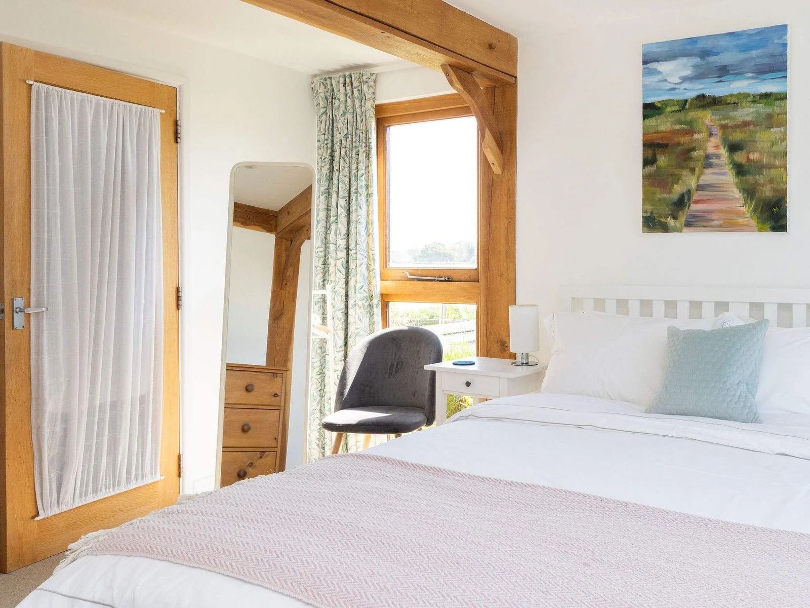 Light-filled master bedroom with a beautiful view