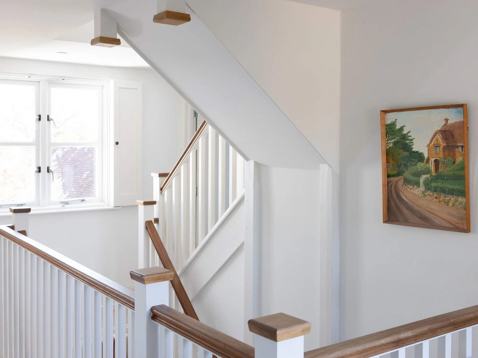 Light-filled landing with character staircase