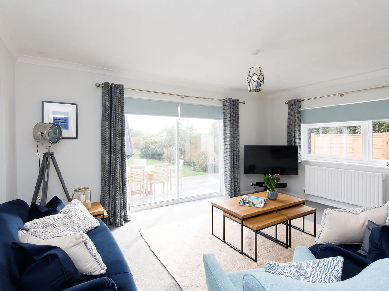 The stylish but cosy lounge has two comfy sofas and an armchair for ultimate relaxation.