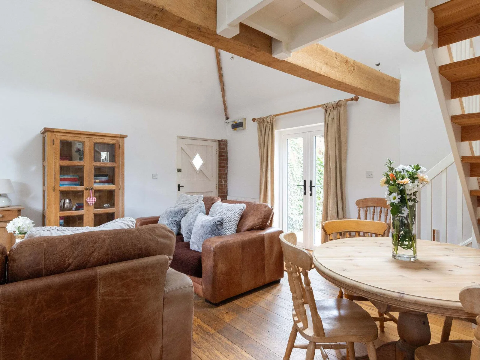 The open-plan living space in The Dairy combines kitchen, dining and seating areas.
