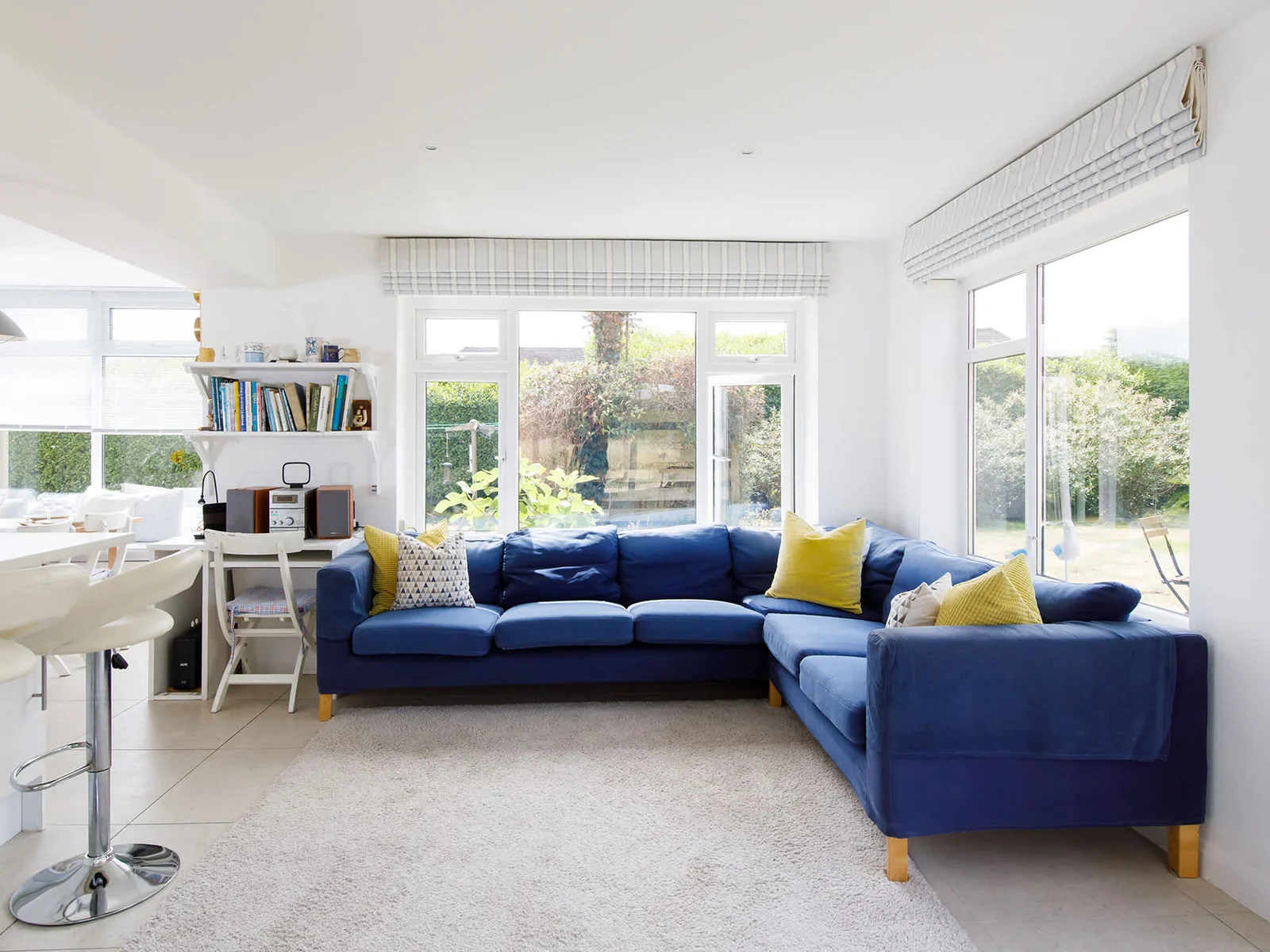 The open plan living space has a wonderful corner sofa, perfect for relaxing with a good book or cup of tea.