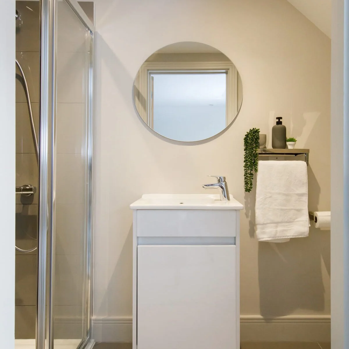 Contemporary ensuite shower room off the master bedroom.