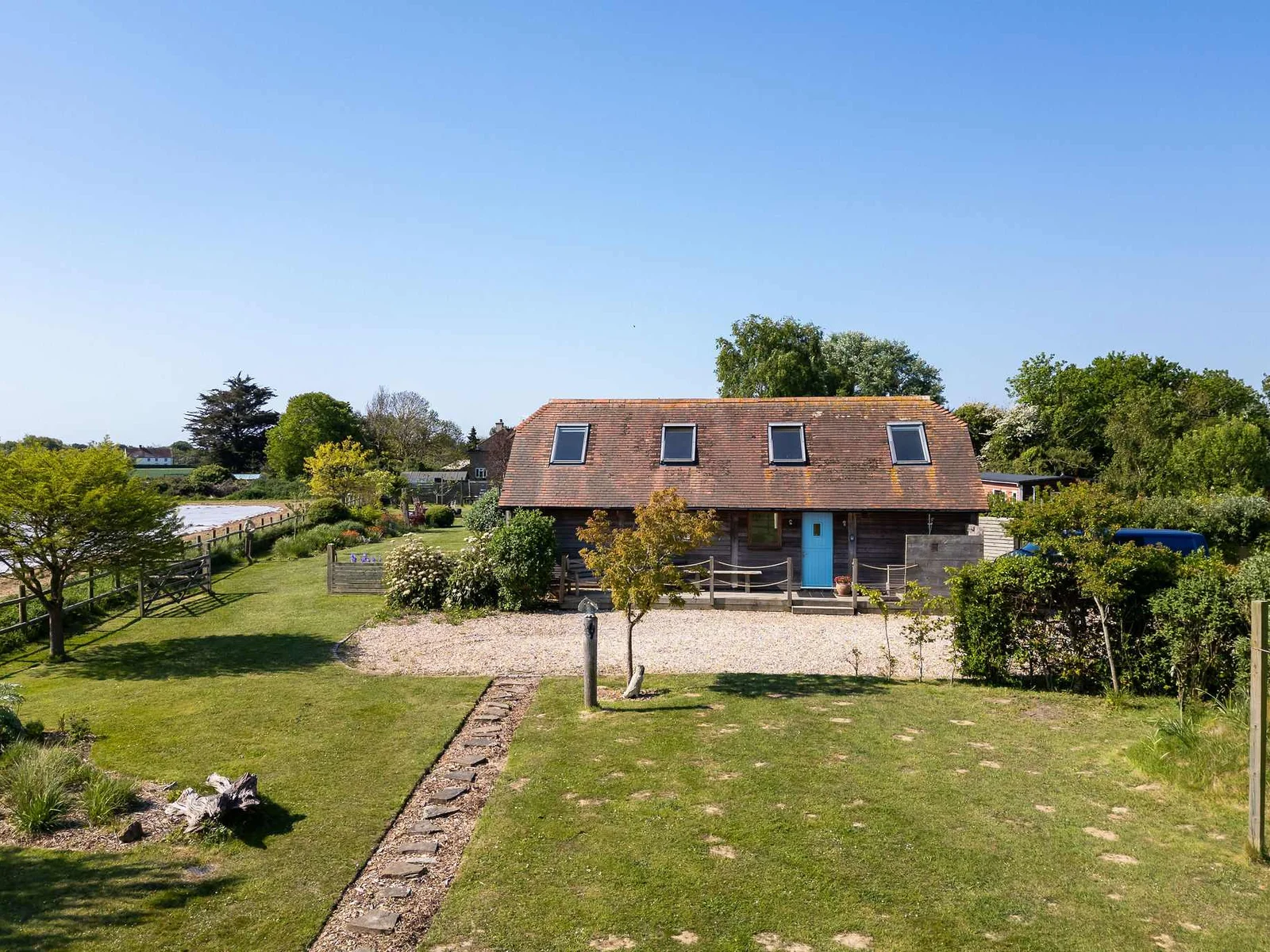 A peaceful haven with ample lawn space and serene views.