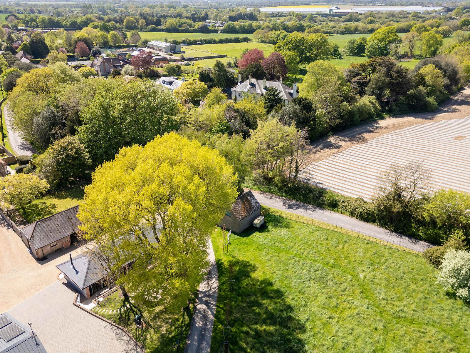 Take in sweeping green views, open fields, and peaceful seclusion across the wider Sussex landscape.