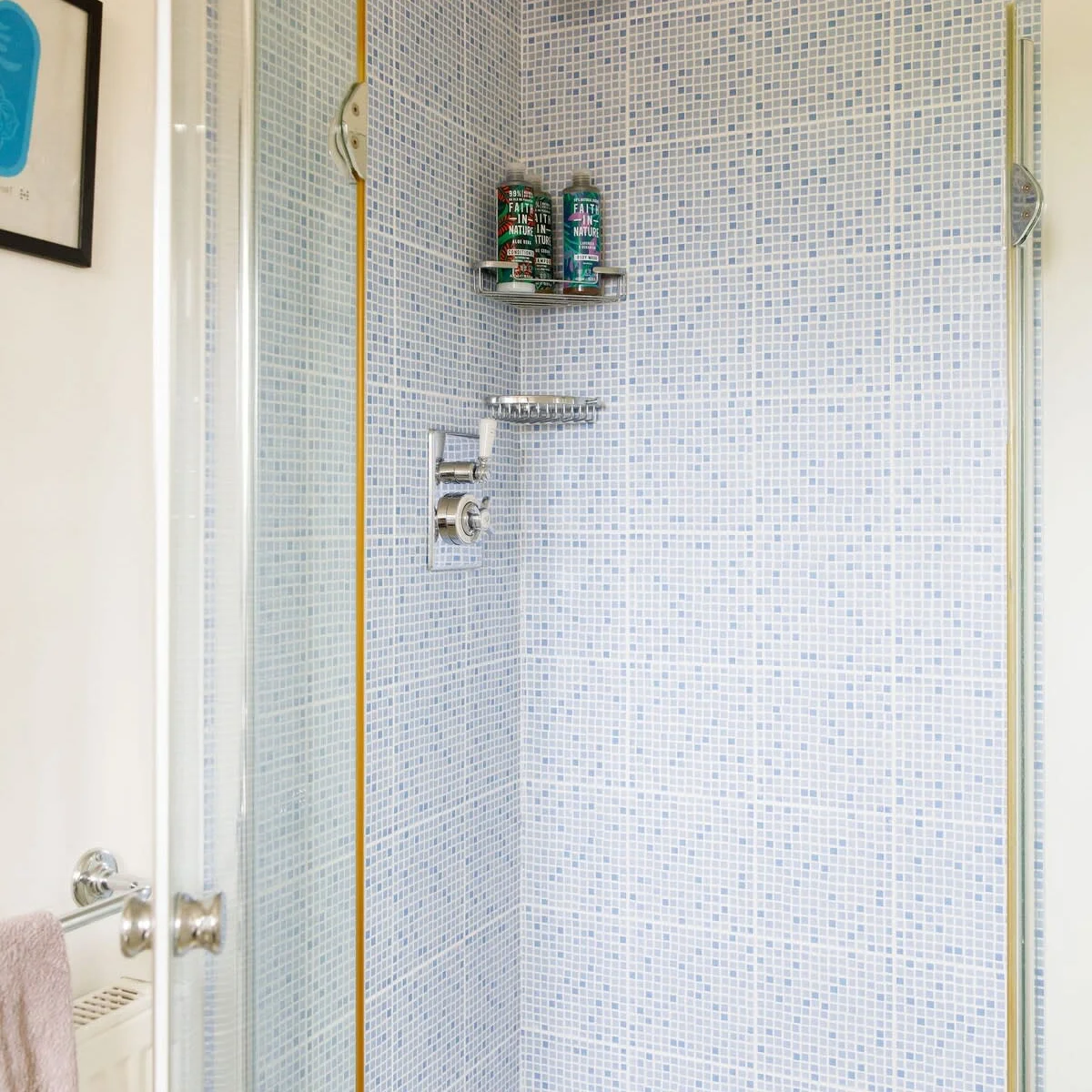 The shower with pretty country tiles.