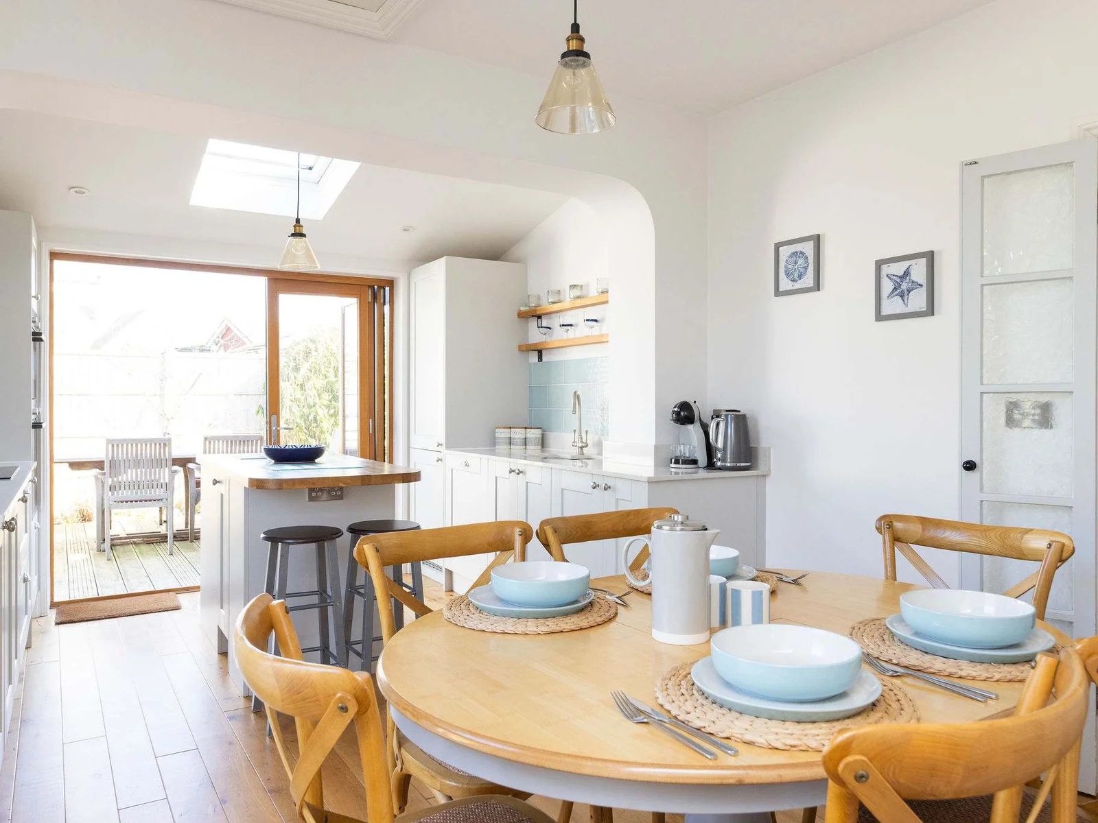 This welcoming space features a fully equipped kitchen and a dining table for six.