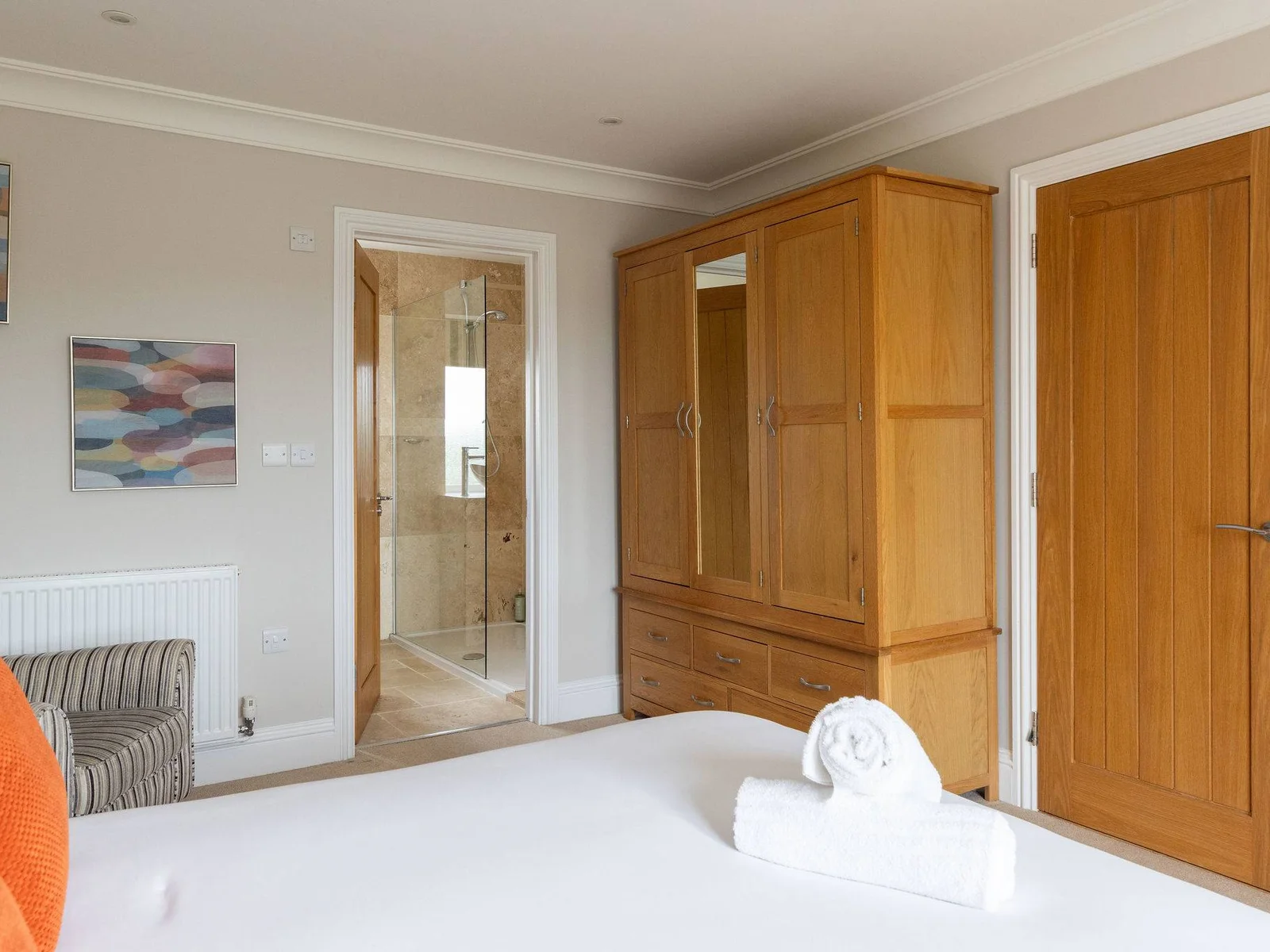 The master bedroom also benefits from generous built-in storage and its own private en-suite, giving the room a little extra comfort and privacy.