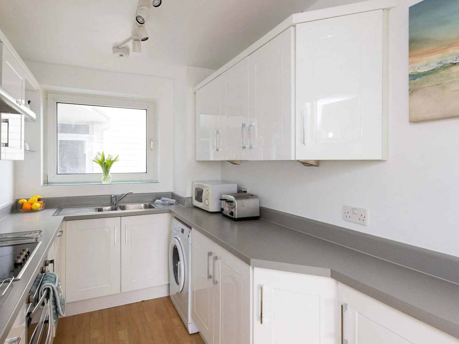 Bright and practical kitchen with generous counter space and modern appliances for easy, stress-free holiday cooking.