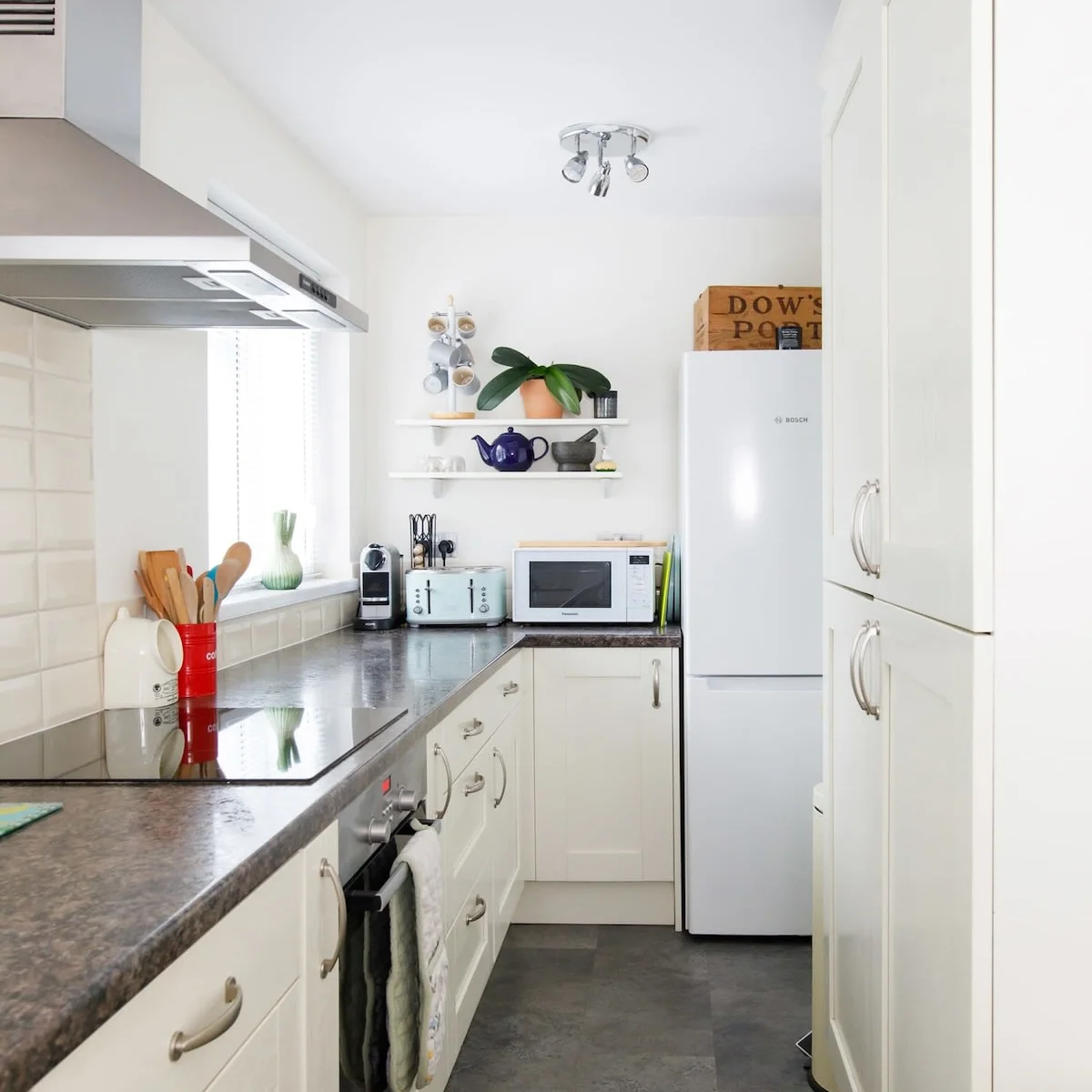 The galley kitchen has spacious worktops and plenty of cabinet space.