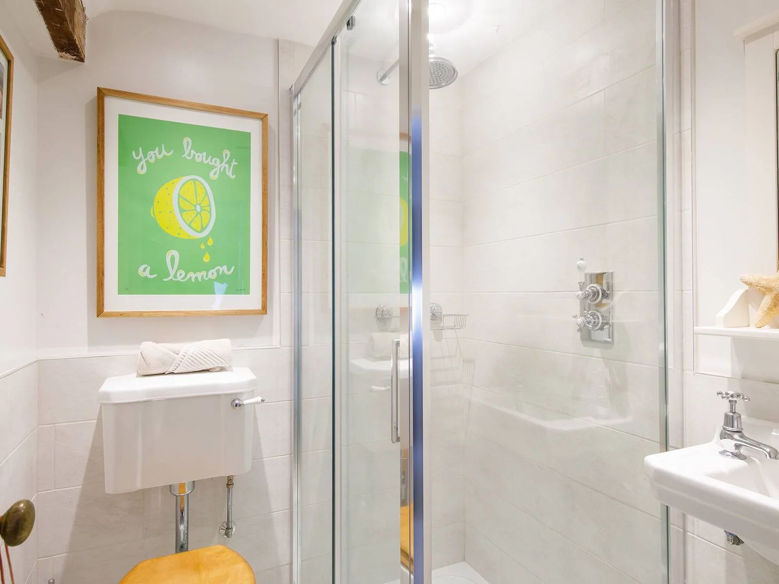 Unique décor colours the bathroom with a modern shower cabin