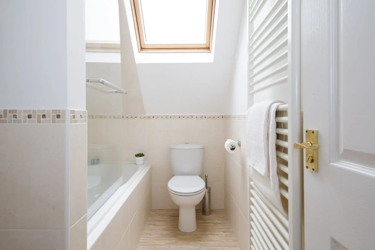 Clean and bright family bathroom.