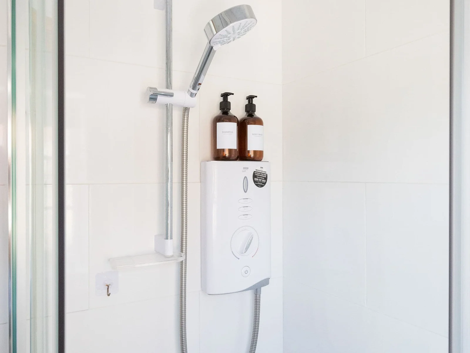 Clean walk-in shower with essentials