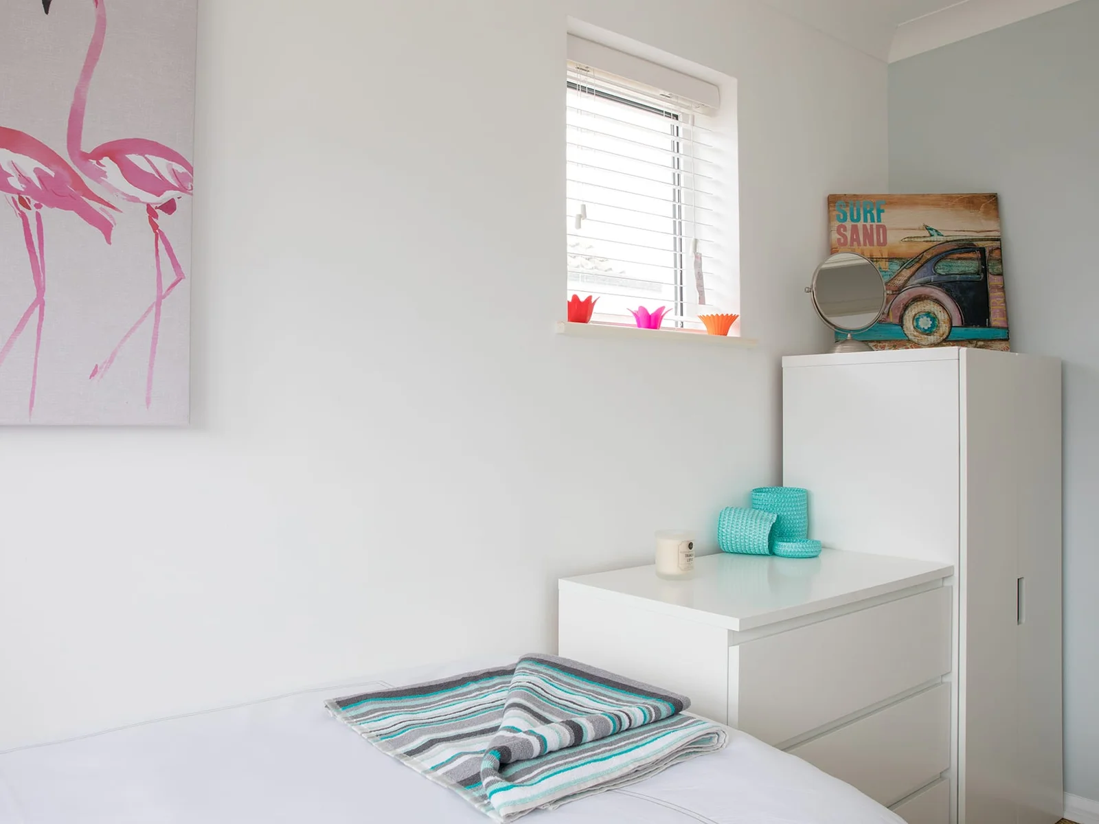 Small closet is paid with a dresser to offer plenty of storage space.