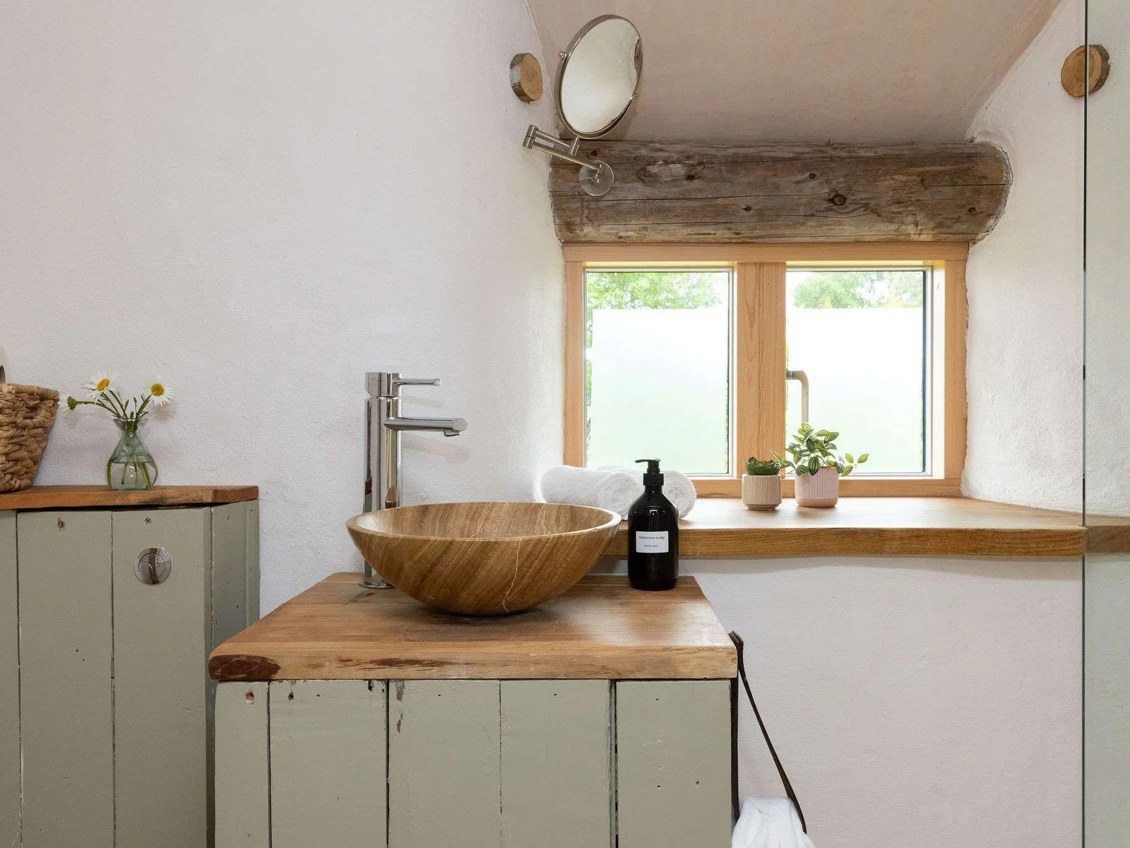 Thoughtfully designed bathrooms with natural materials and handcrafted details throughout.