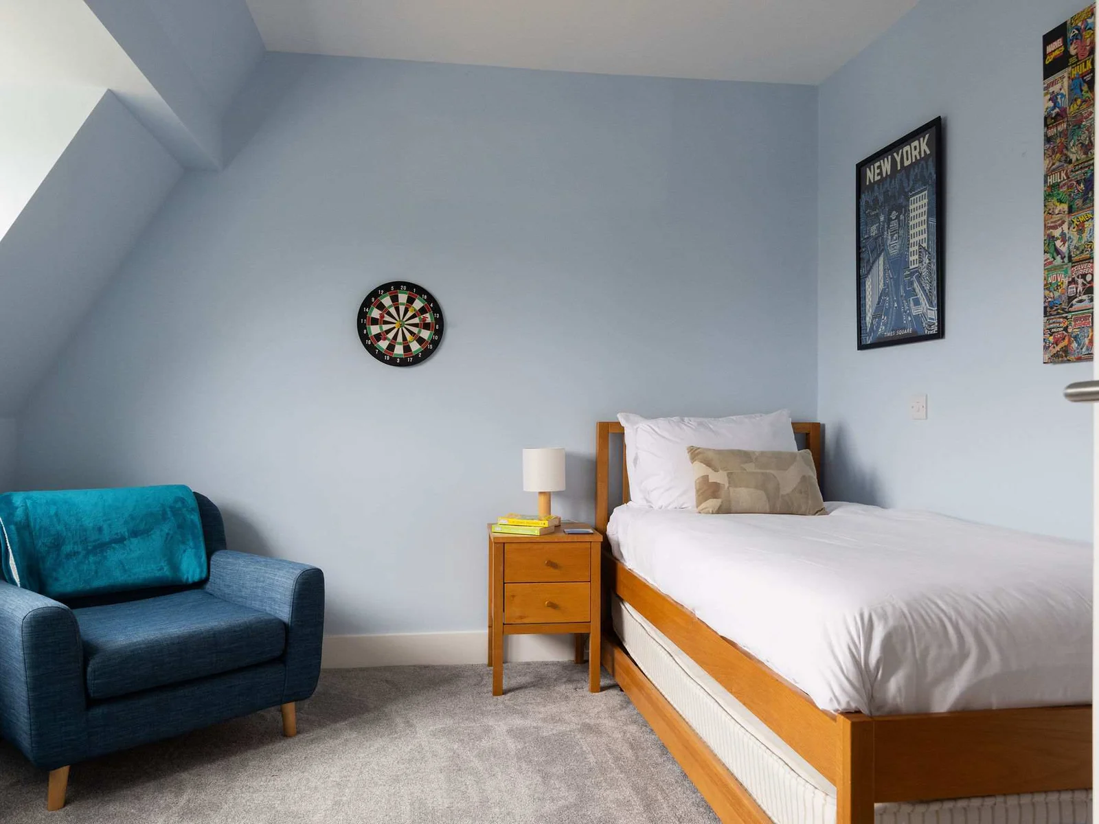 A fun, characterful bedroom with a trundle bed under a single