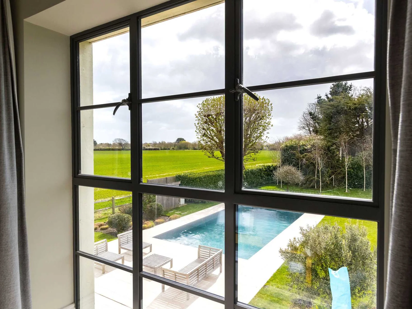 Enjoy gorgeous views of the heated pool and surrounding countryside from the upper floor.