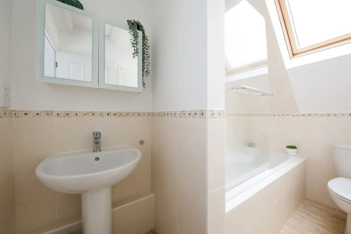 Clean and bright family bathroom