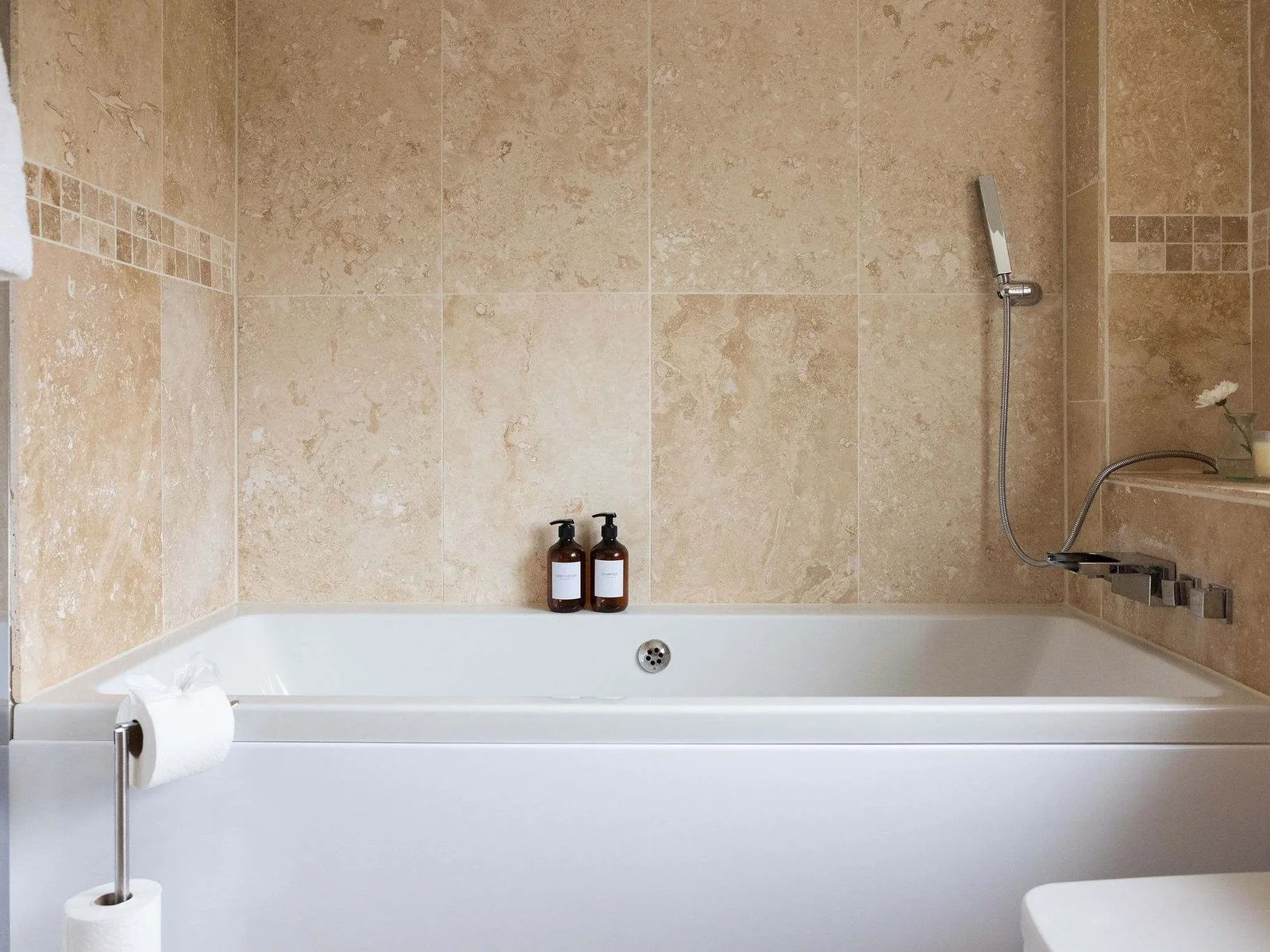 Sink into a long, relaxing bath and enjoy a little quiet time in the master en-suite.