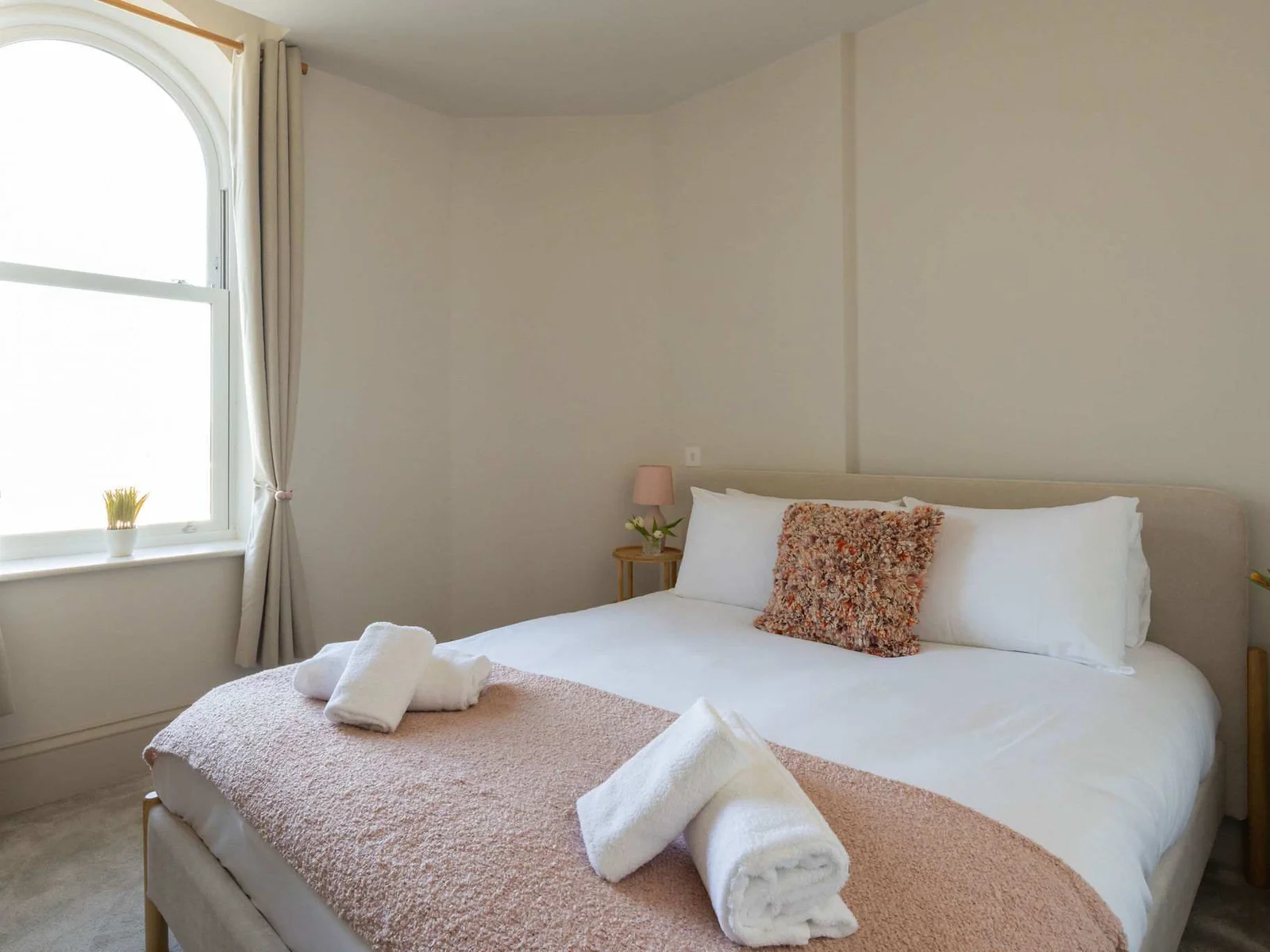 Soft, restful bedrooms offer a welcoming retreat after time spent by the sea.