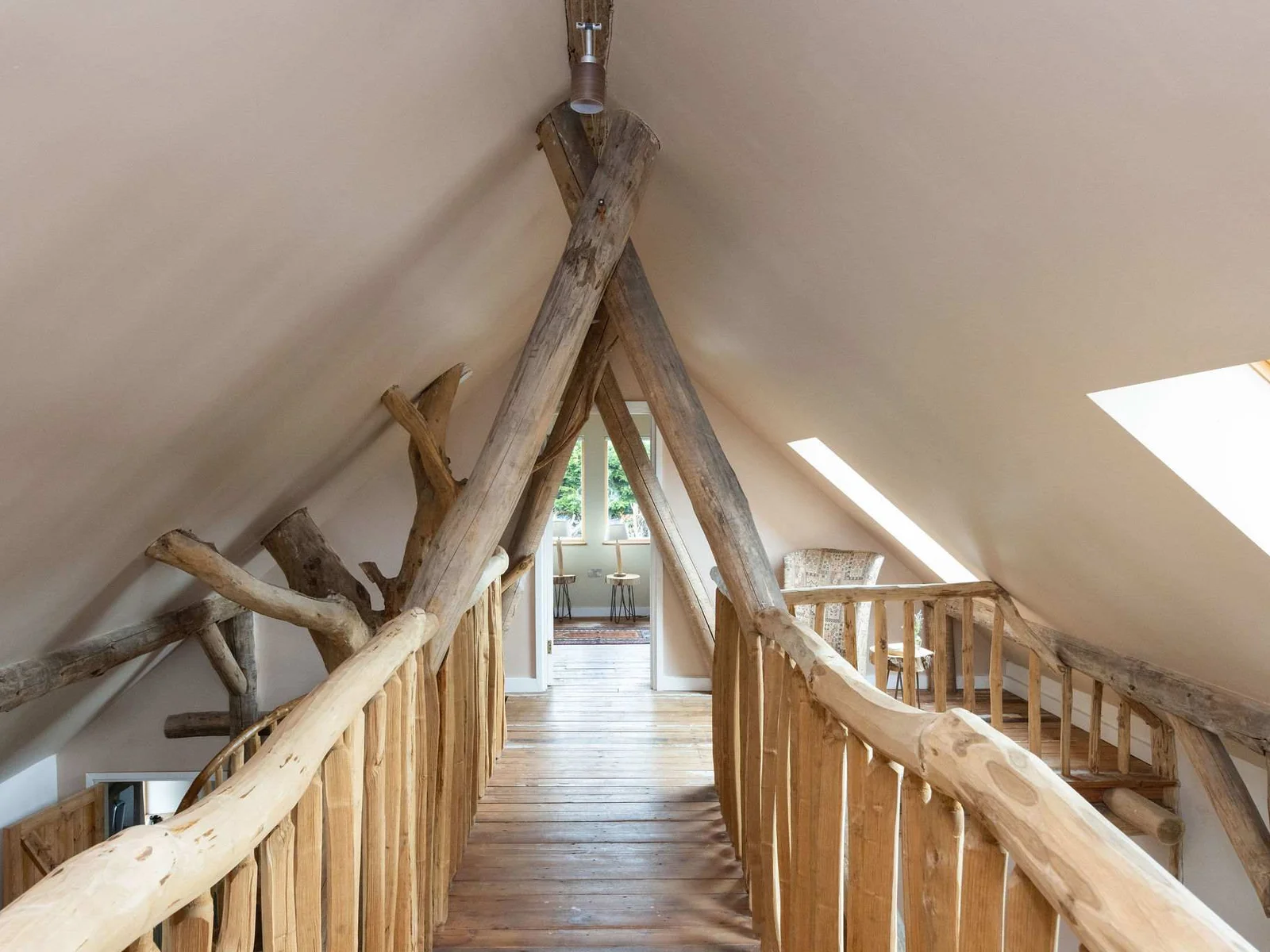 A truly one-of-a-kind mezzanine landing — woodland craftsmanship around every corner.