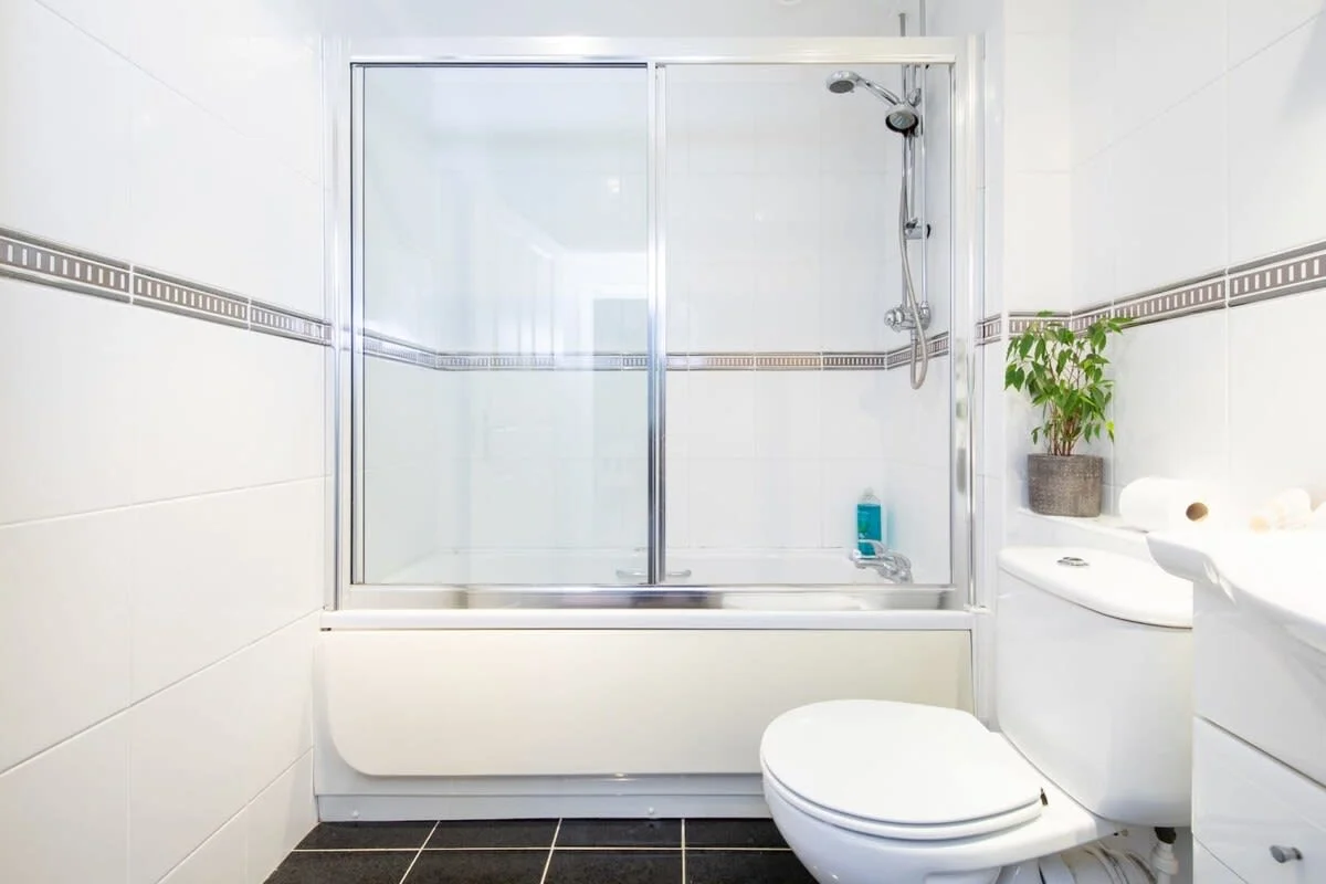 The downstairs bathroom with tub and shower.