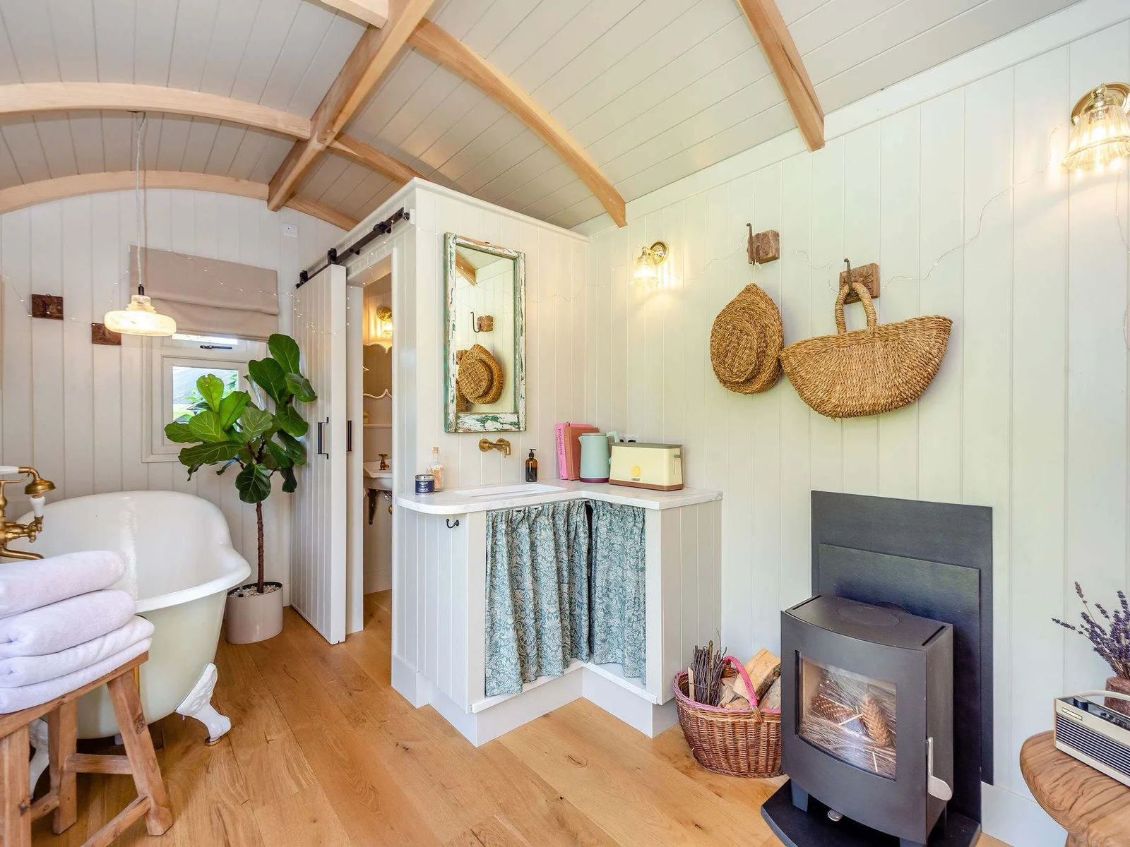 Unwind beside the wood burner, with your own freestanding bath just steps away