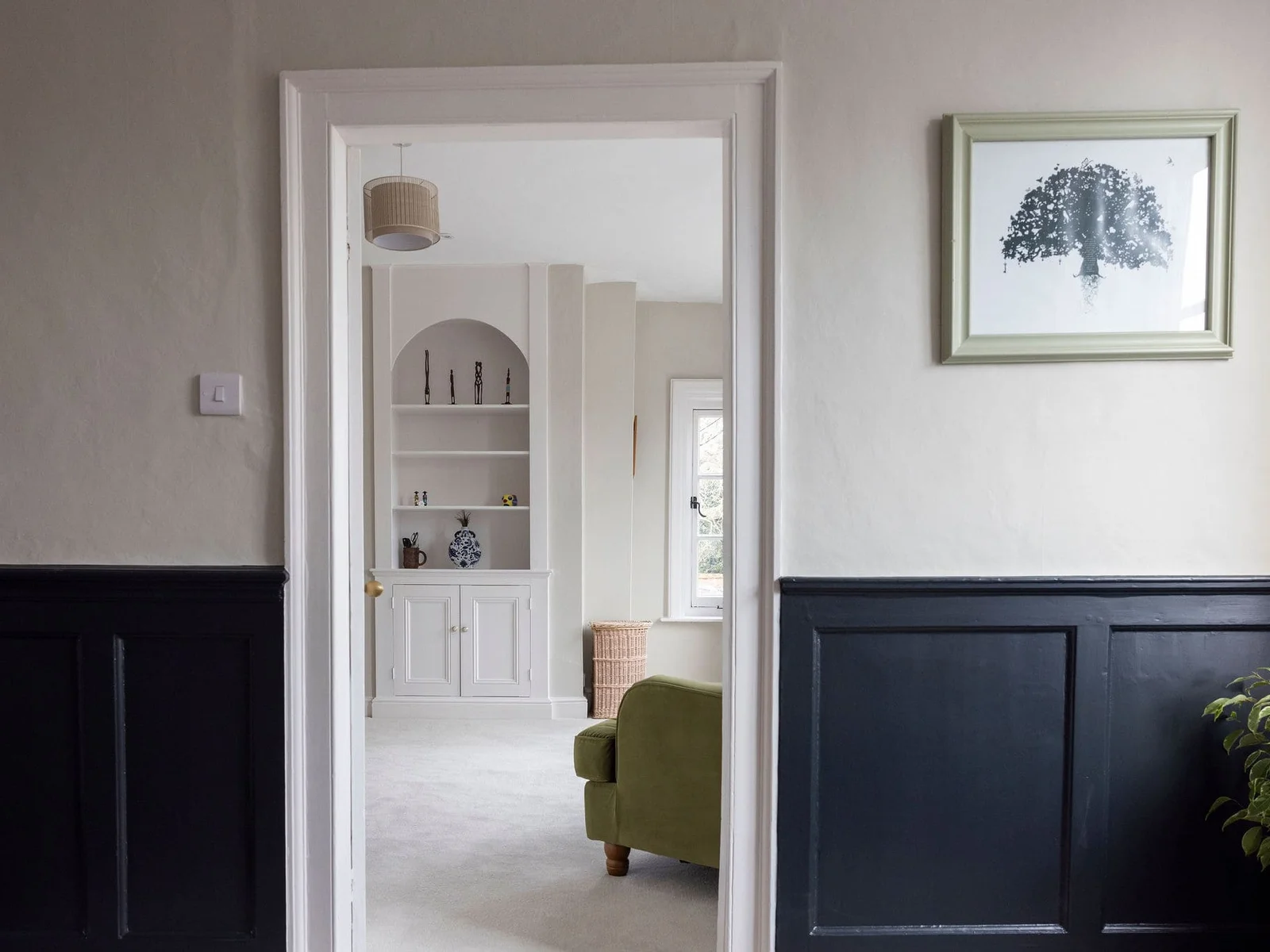 Charming hallway with classic paneling and modern touches