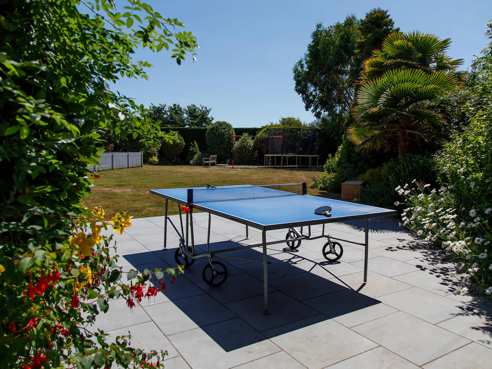 The home has two ping pong tables - one inside and one outside.