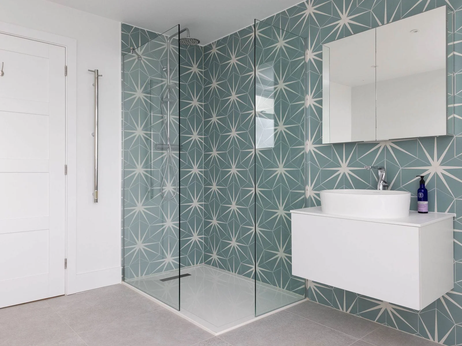 A stylish shower room with a fresh seaside feel