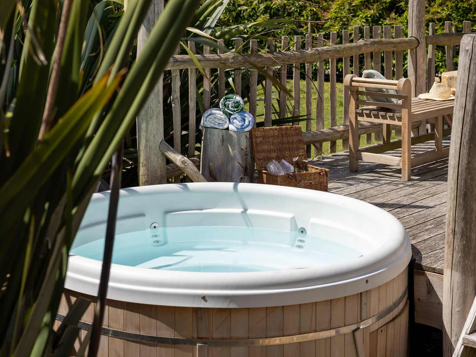 Soak away the day in your private hot tub, tucked amongst the trees.