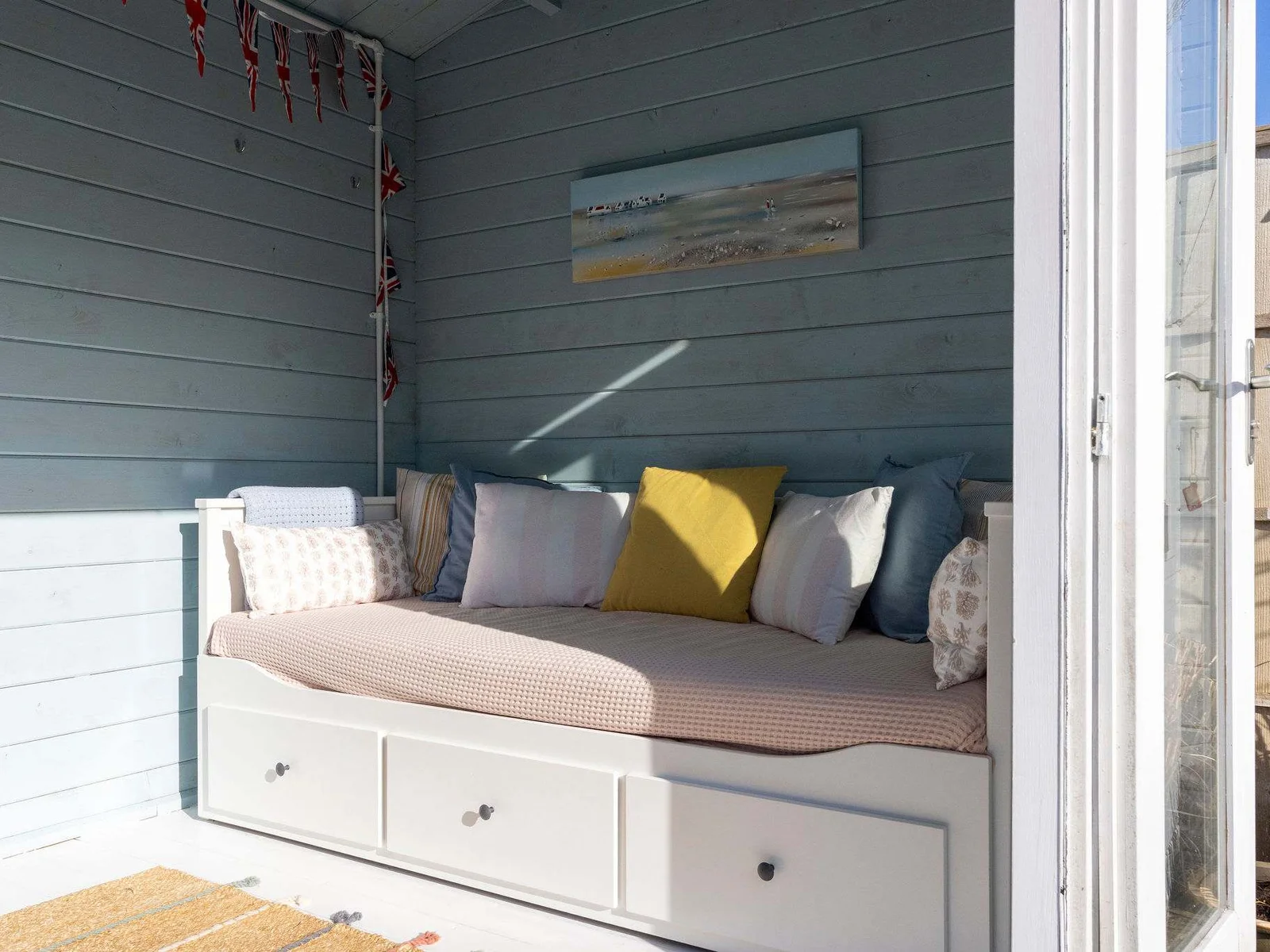 Unwind in the daybed, an ideal spot for reading or enjoying a quiet moment.