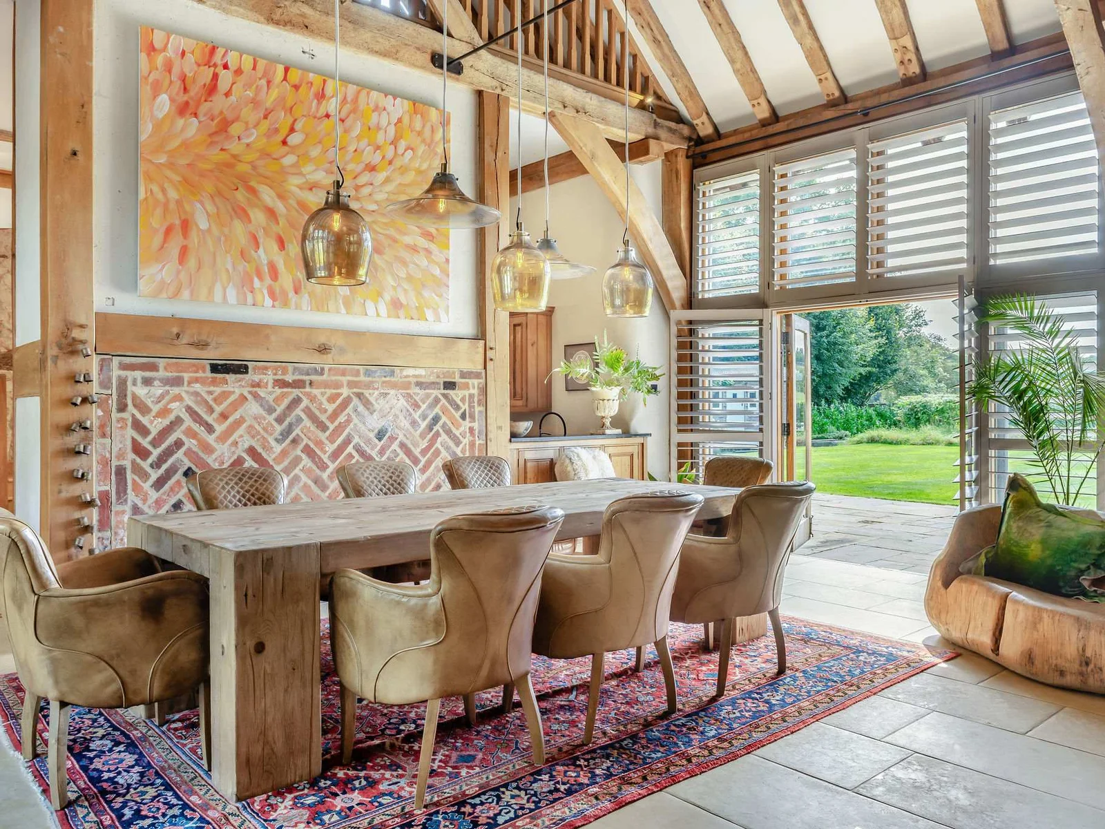 Gather around the large dining table with doors opening straight onto the grounds