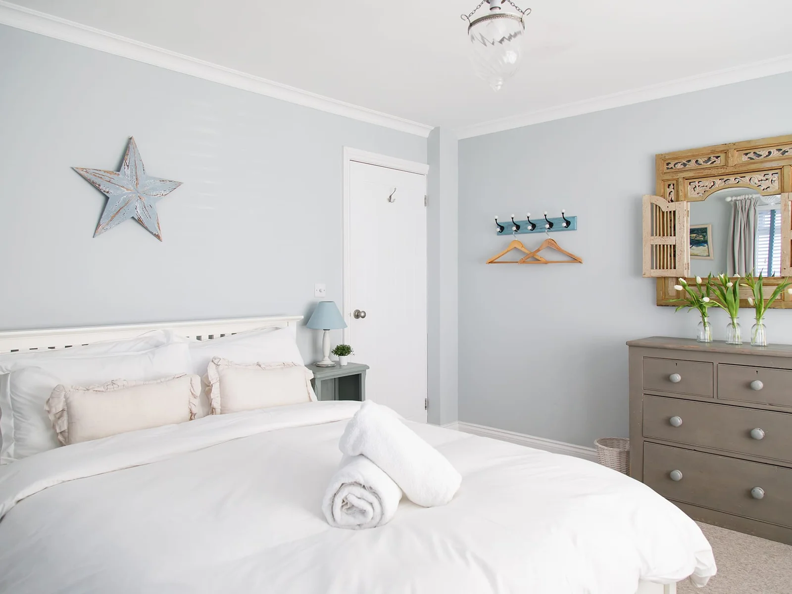 The bedrooms are beautifully decorated and furnished in cool greys and blues.