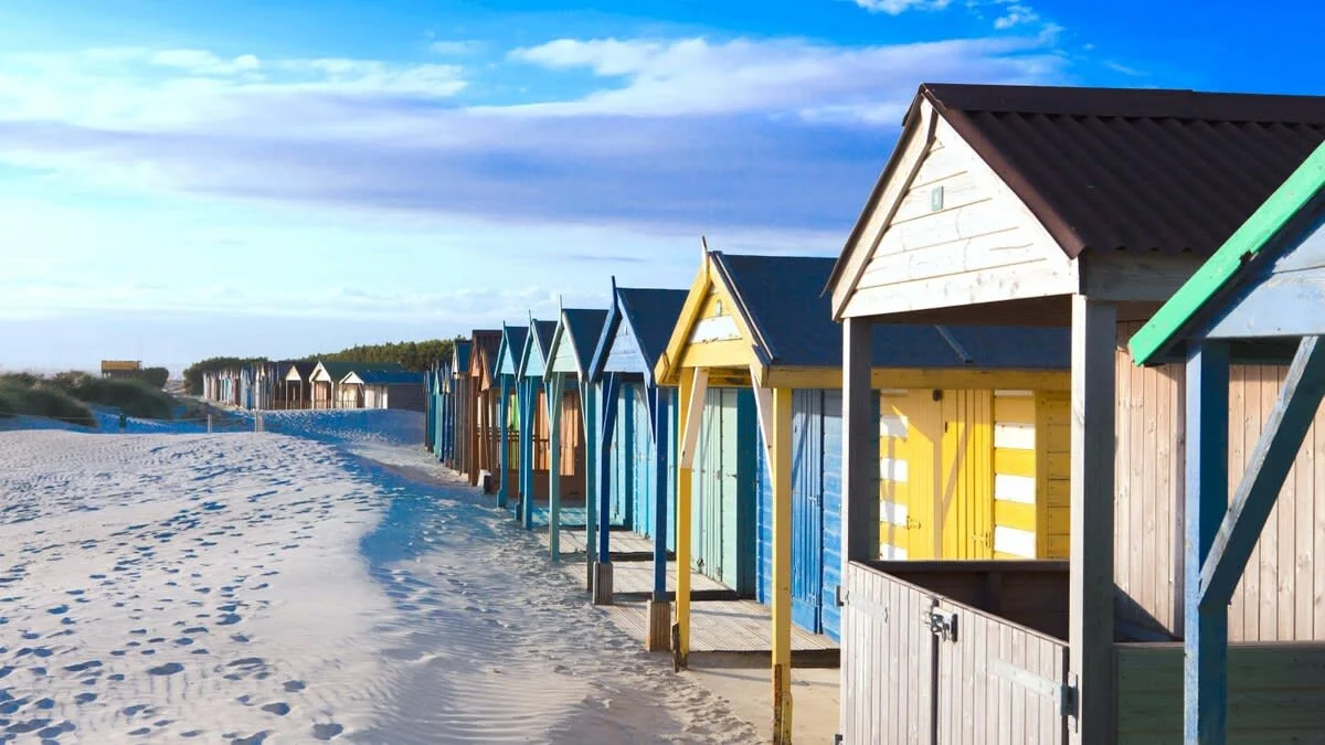 Visit the Witterings for sandy dunes and pretty beach huts.