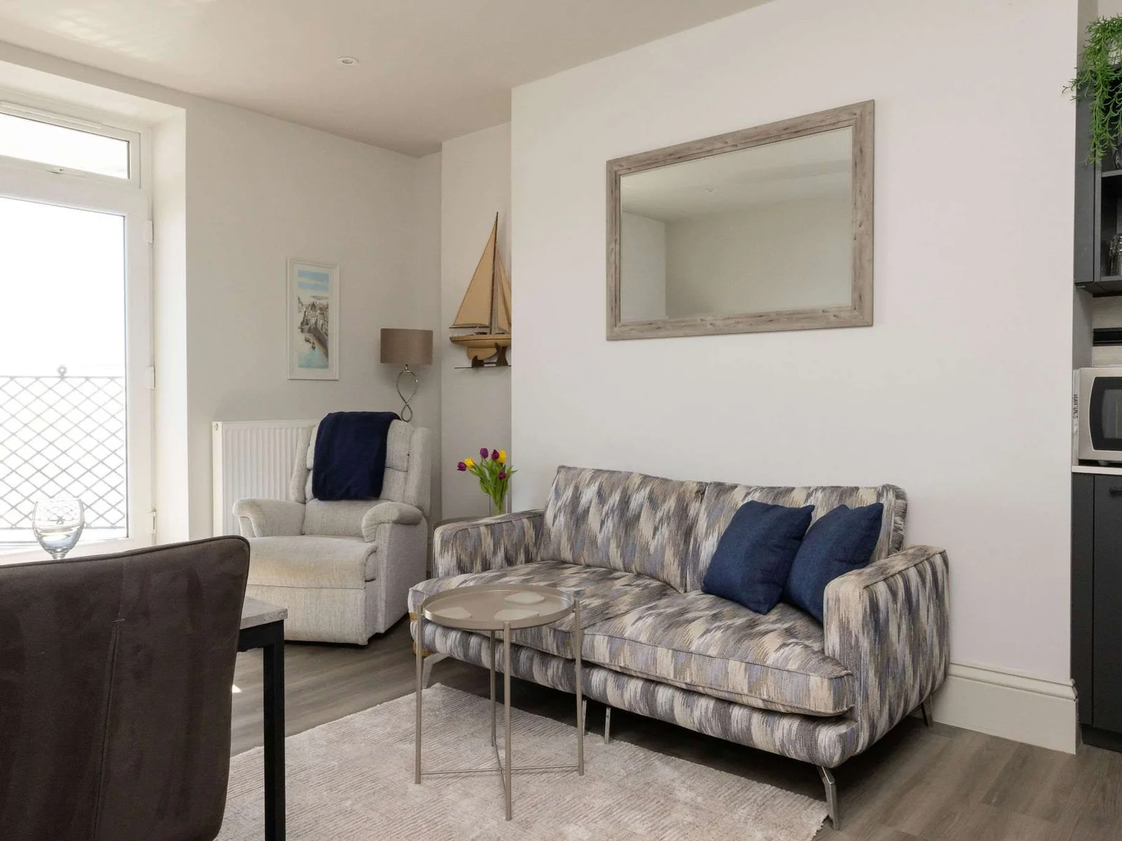 Comfortable interiors bring a calm coastal feel to this well-located apartment.