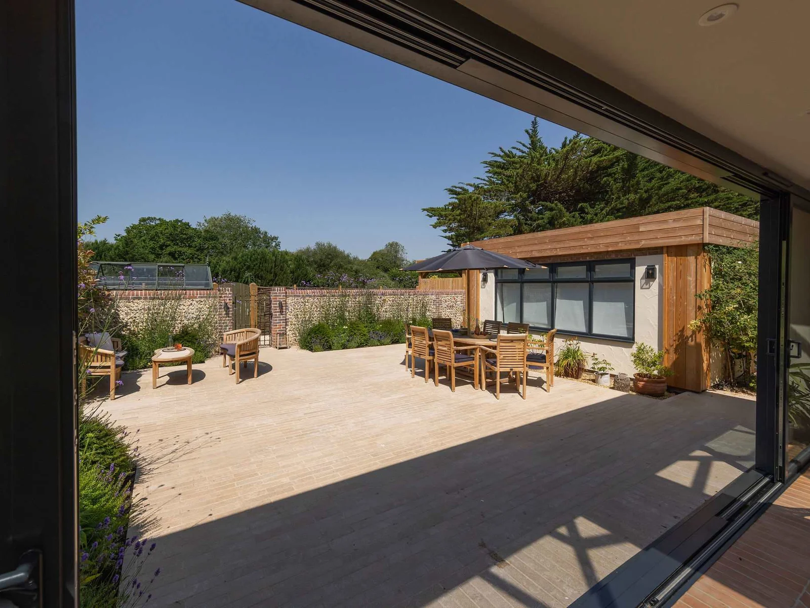 Expansive patio with outdoor seating, creating an inviting setting for al fresco relaxation
