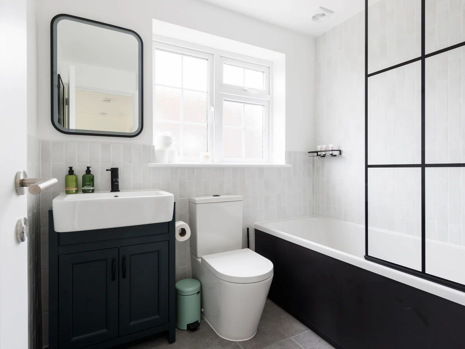 Sleek bathroom design with modern fixtures, a bathtub, and a spacious layout