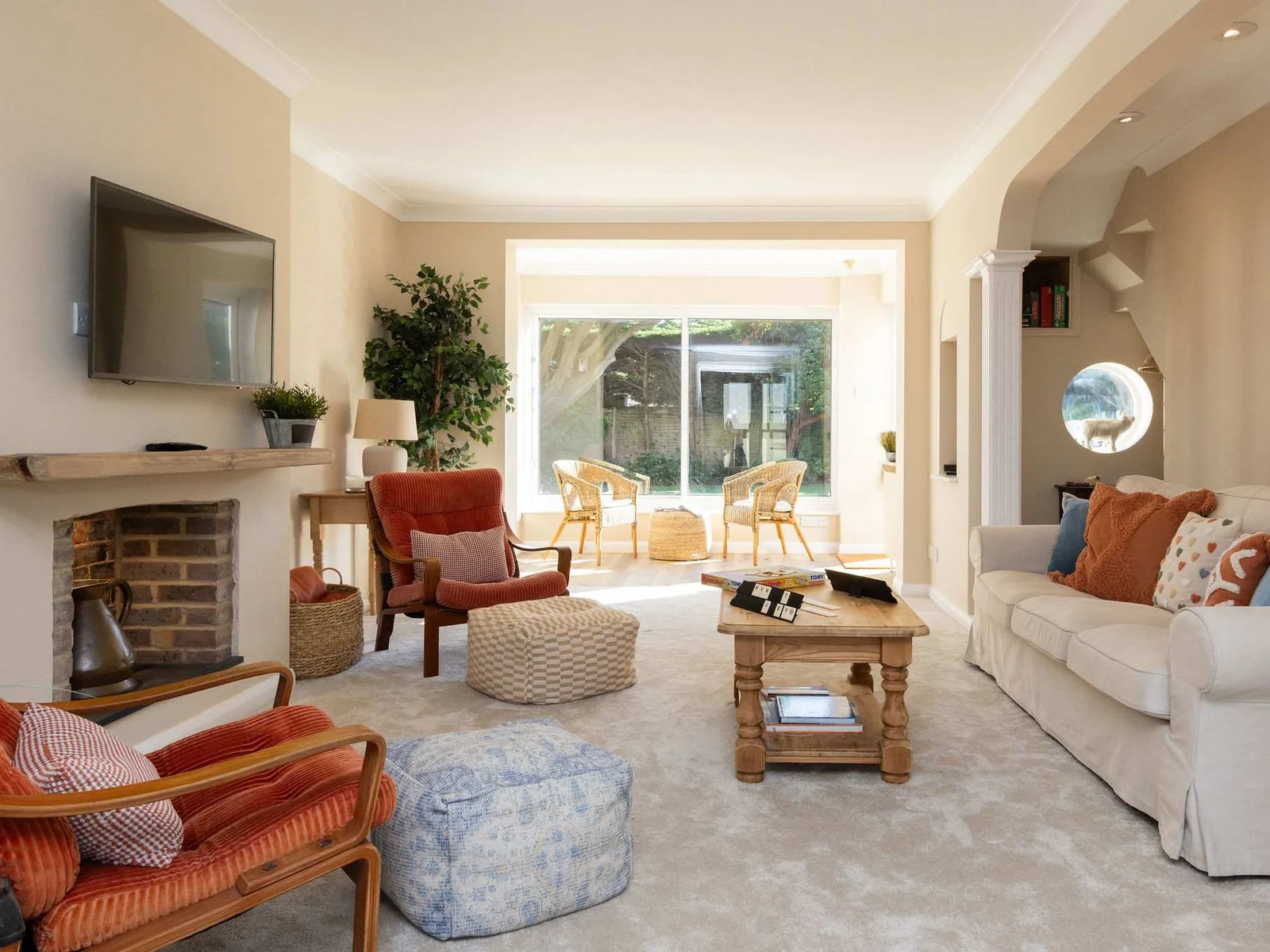 The lounge has ample seating including a 3 seater sofa and chairs.
