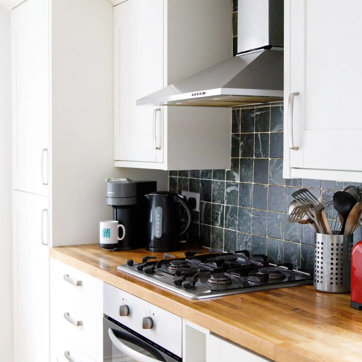 There is an oven, 4 gas rings, toaster, kettle and coffee machine.