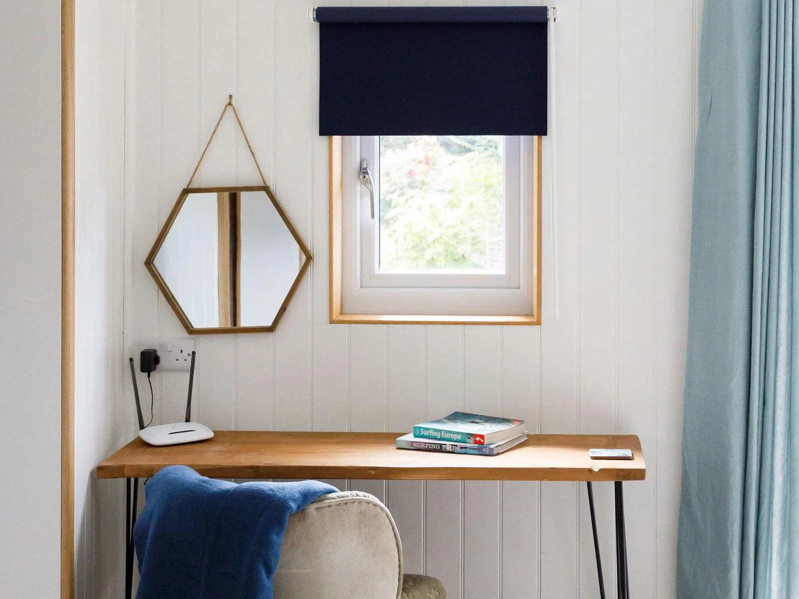 A desk and chair can be found in the living space, making catching up with work easy.